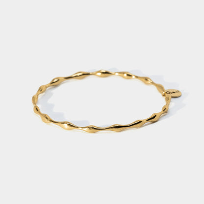 Gold bracelet on a white background